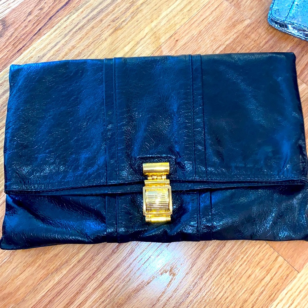 Small black and neon pink clutch purse.